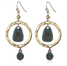 Blue in hoop earrings