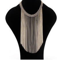 Multi layered gold colored tassel necklace