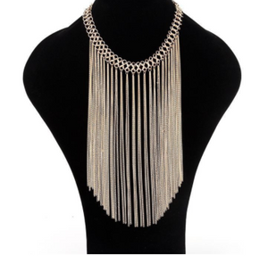 Multi layered gold colored tassel necklace