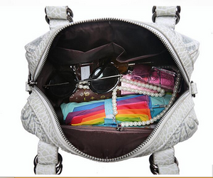 Satchel with embossed floral design