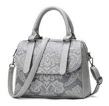 Satchel with embossed floral design
