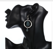 Blue in hoop earrings