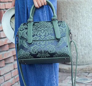 Satchel with embossed floral design