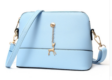 Shell high quality leather bag in solid colors.