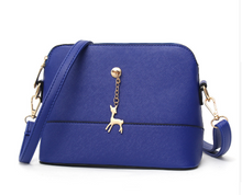 Shell high quality leather bag in solid colors.