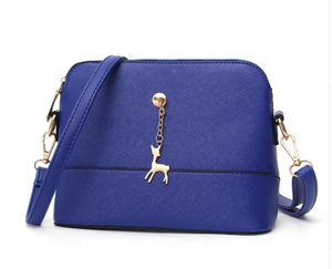 Shell high quality leather bag in solid colors.