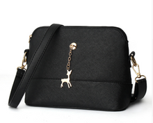 Shell high quality leather bag in solid colors.