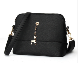 Shell high quality leather bag in solid colors.